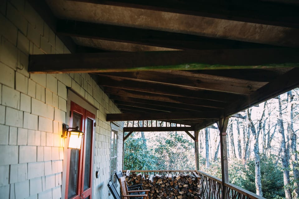 Exterior with rocking chair front porch overlooking the private yard.