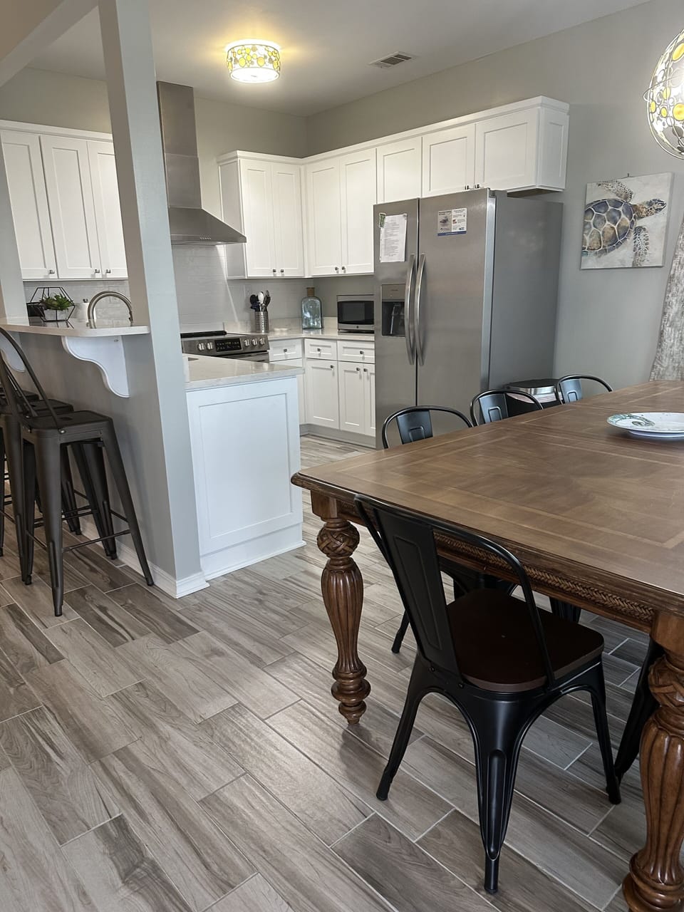 kitchen table sits 6 bar sits 4
open to living room