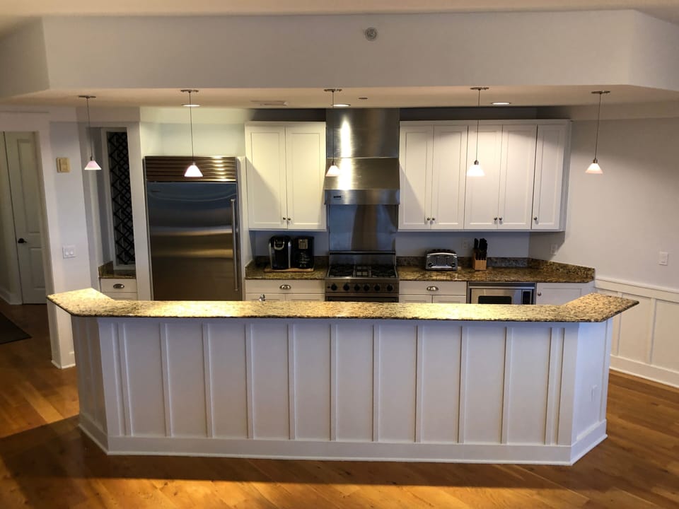 White kitchen with top of line Subzero and Wolf appliances