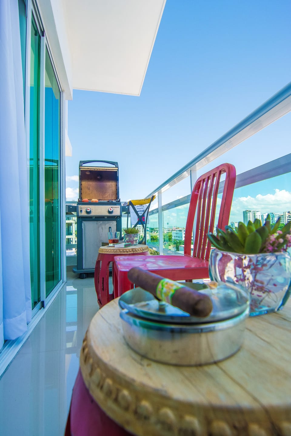 The Private Balcony with beautiful city views comes with a table, seats and barb