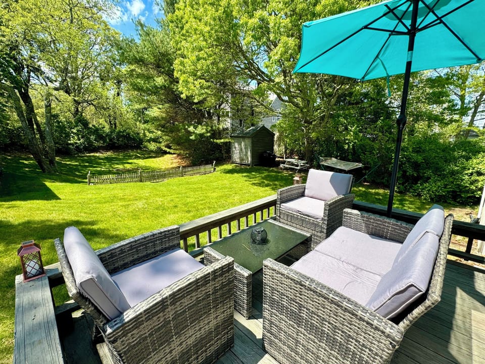 Brand new patio furniture on the deck overlooking the backyard