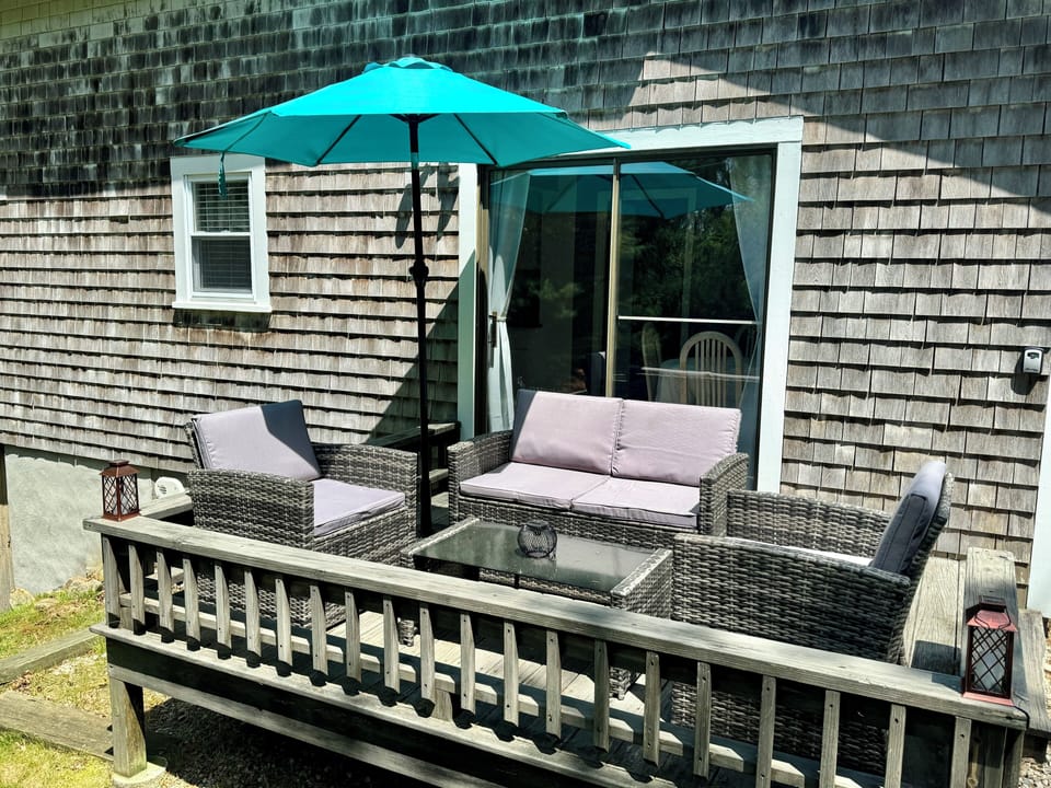 Brand new patio furniture on the deck overlooking the backyard 