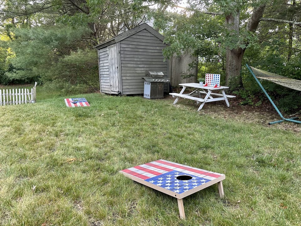 Enjoy the quarter acre backyard with a grill, bench, hammock and outdoor games
