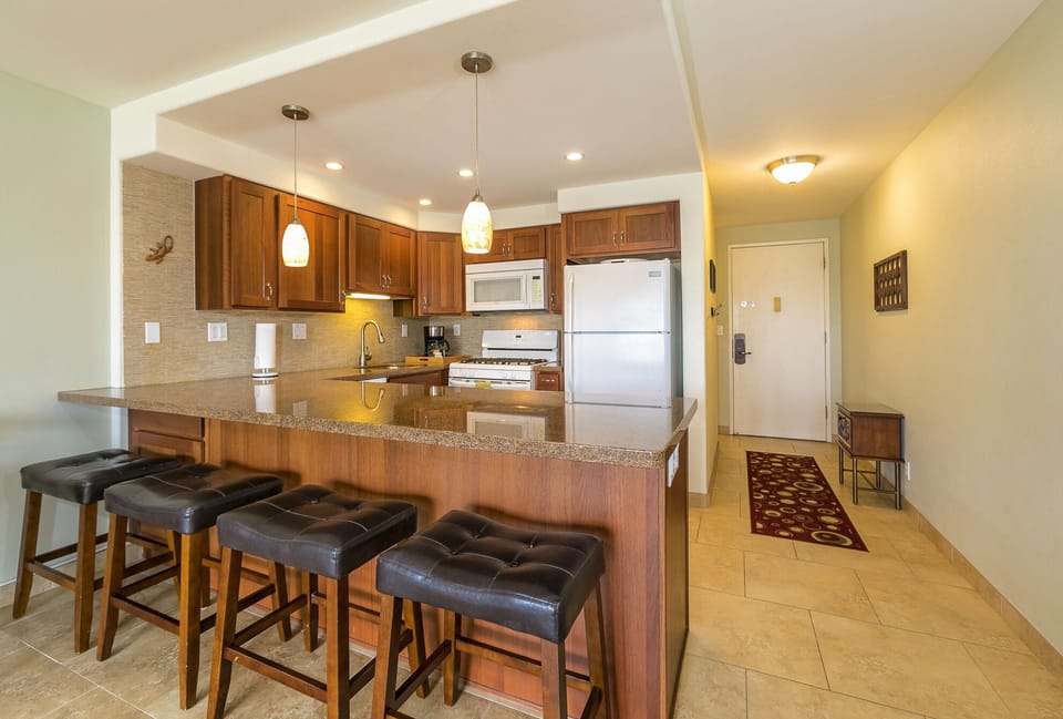 Full kitchen with dishwasher, oven/stove, microwave, fridge and garbage disposal