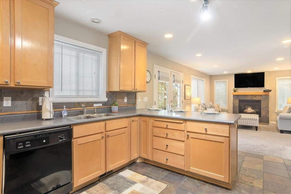 Kitchen opens to comfortable living room TV lounge area