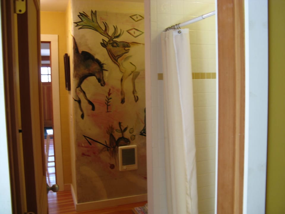cool murals in the downstairs bath w/ shower