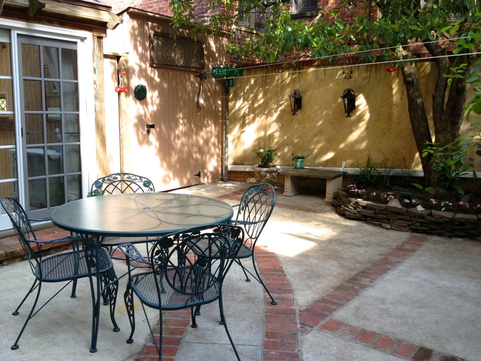 RARE driveway (optional parking), 5 short steps lead to our PRIVATE courtyard