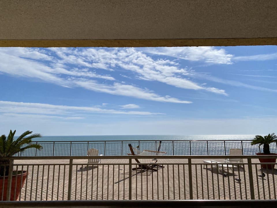 There is a 10 foot deep space between the Sun Deck & condo balcony