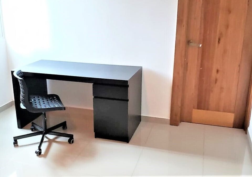 The desk in the bedroom