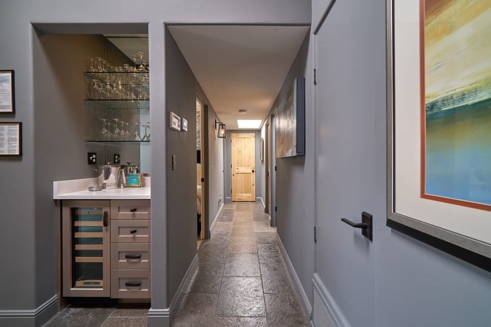 Your hallway to bedrooms and guest bathroom. Sonos with speakers throughout.