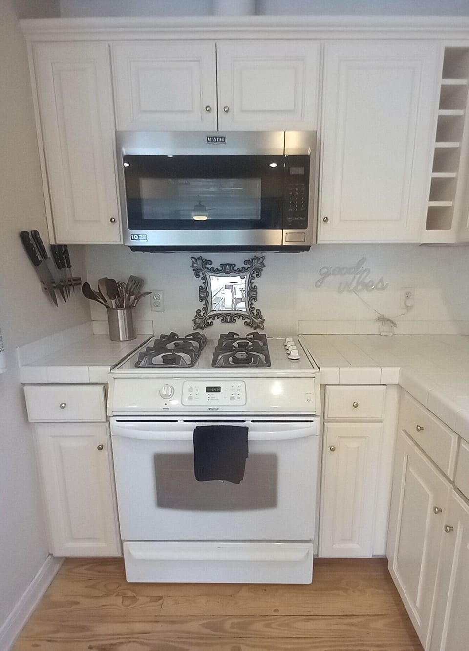 Fully equipped kitchen w/ample storage, microwave, gas stove top, electric oven.