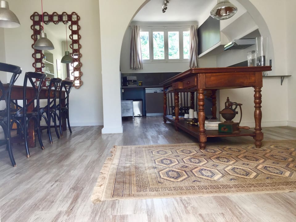 The Kitchen & dining area with its unique wooden table from the Hermes factory