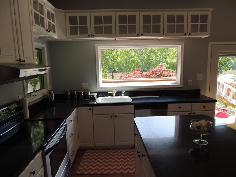 A large open-concept kitchen with a view. 