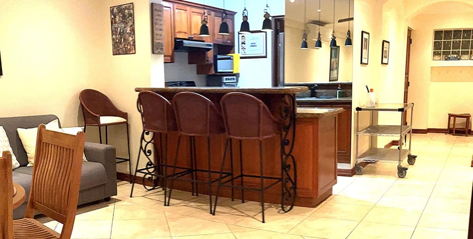 The breakfast bar separates kitchen from the living room