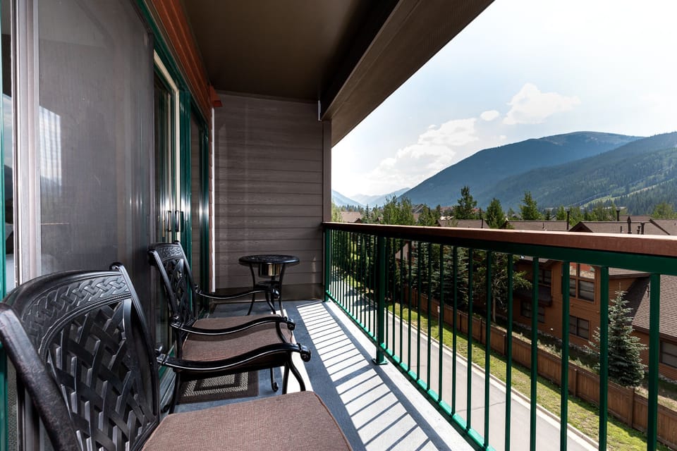 Your private balcony offers comfortable seating and stunning mountain vistas, perfect for morning coffee or evening relaxation.