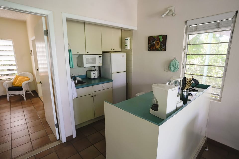 Full kitchenette, electric stove.  Dishes & utensils included.