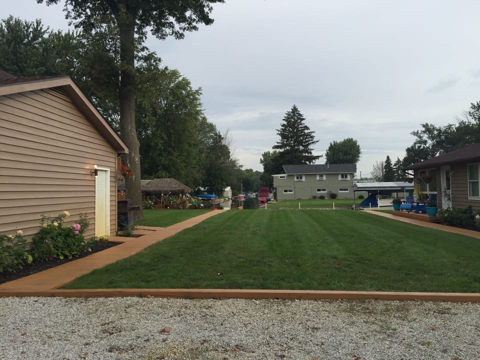 Courtyard to the Channel & boat Pier with plenty of space to play yard games 