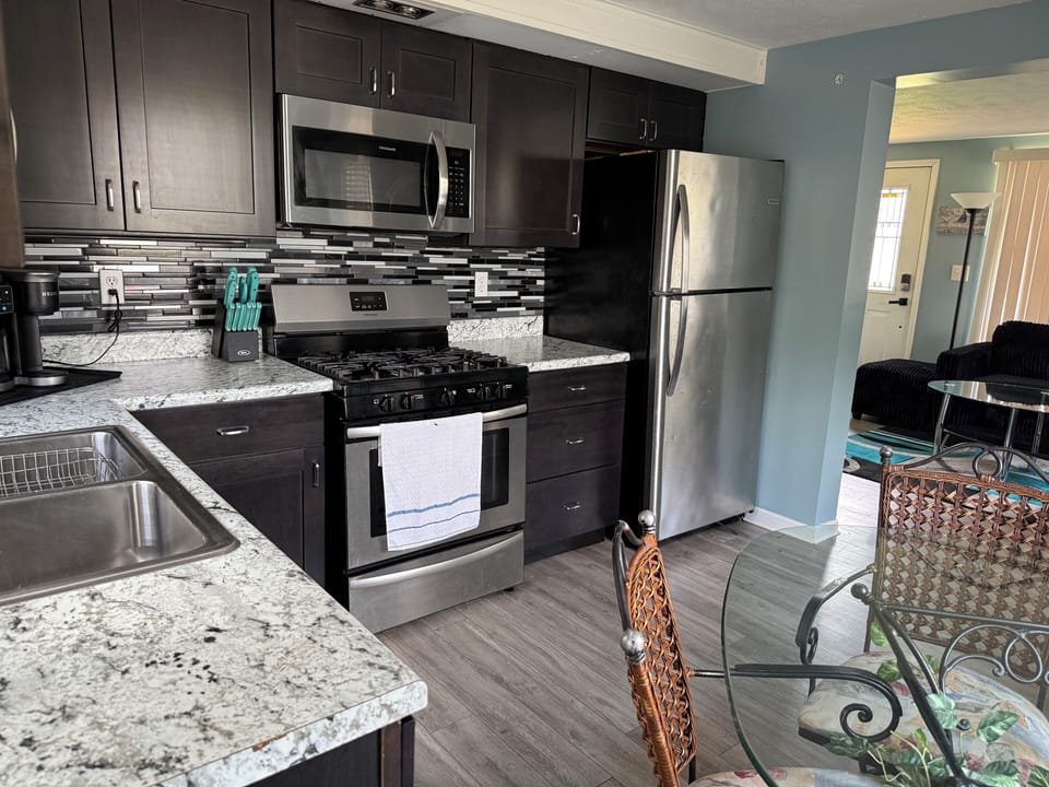 View of the kitchen with all stainless steel appliances.
