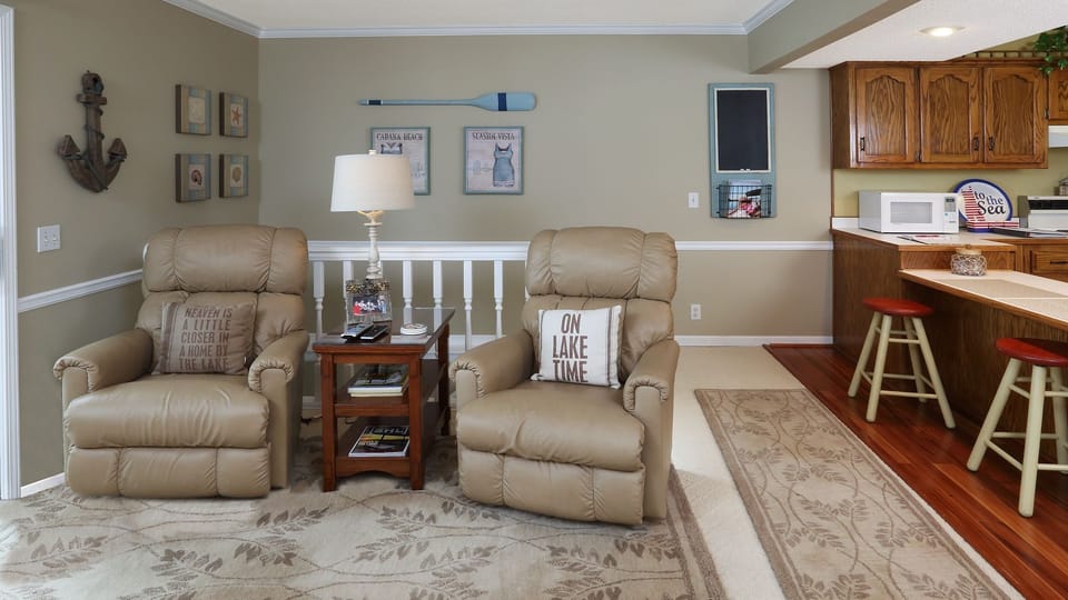Main level living area with comfortable leather reclining chairs.