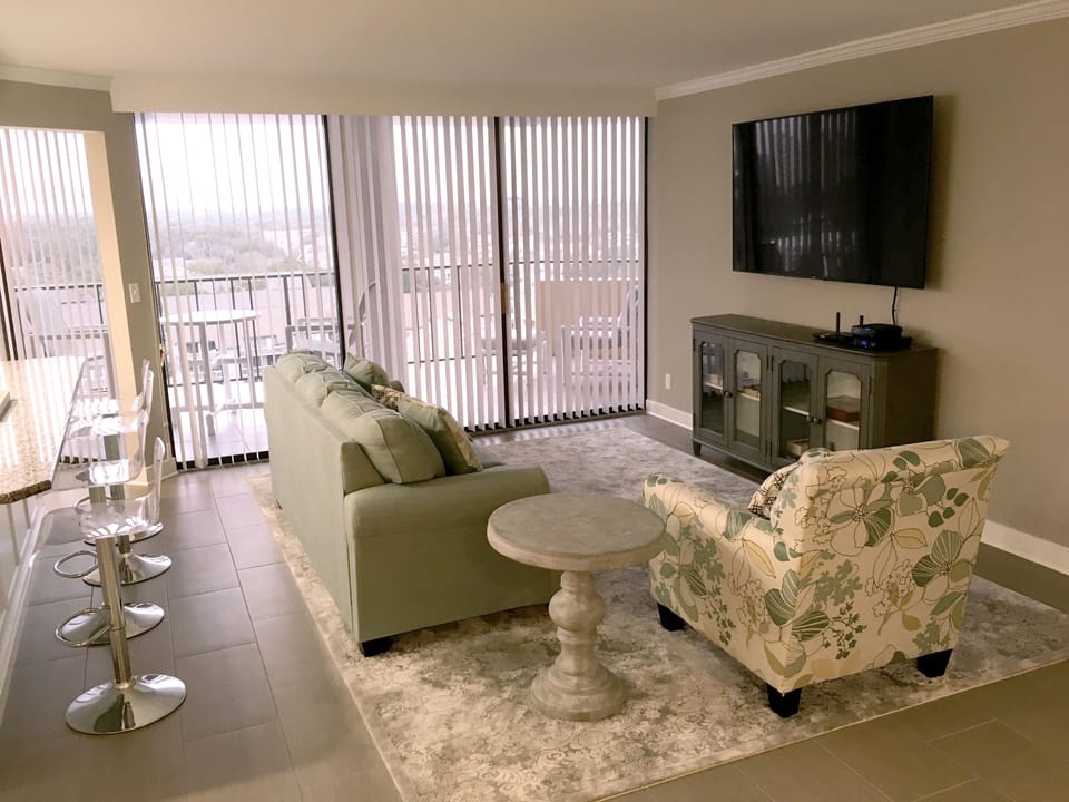 Sunny living room with 70-inch TV