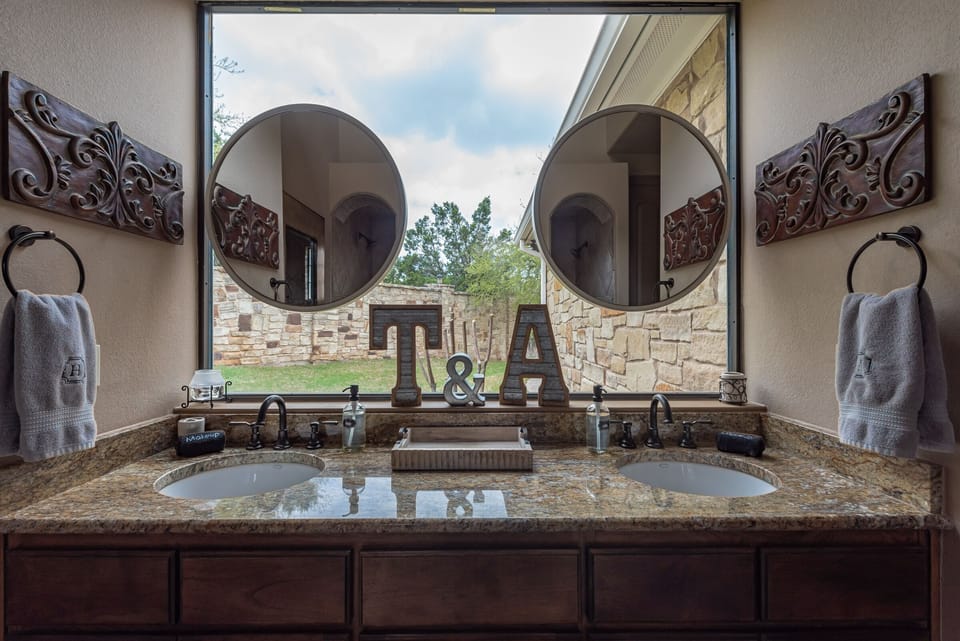 Master Bath Dual sinks with full view window out to the side yard
