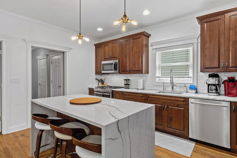 Kitchen.  Quartzite countertops.  Island seats three(3).