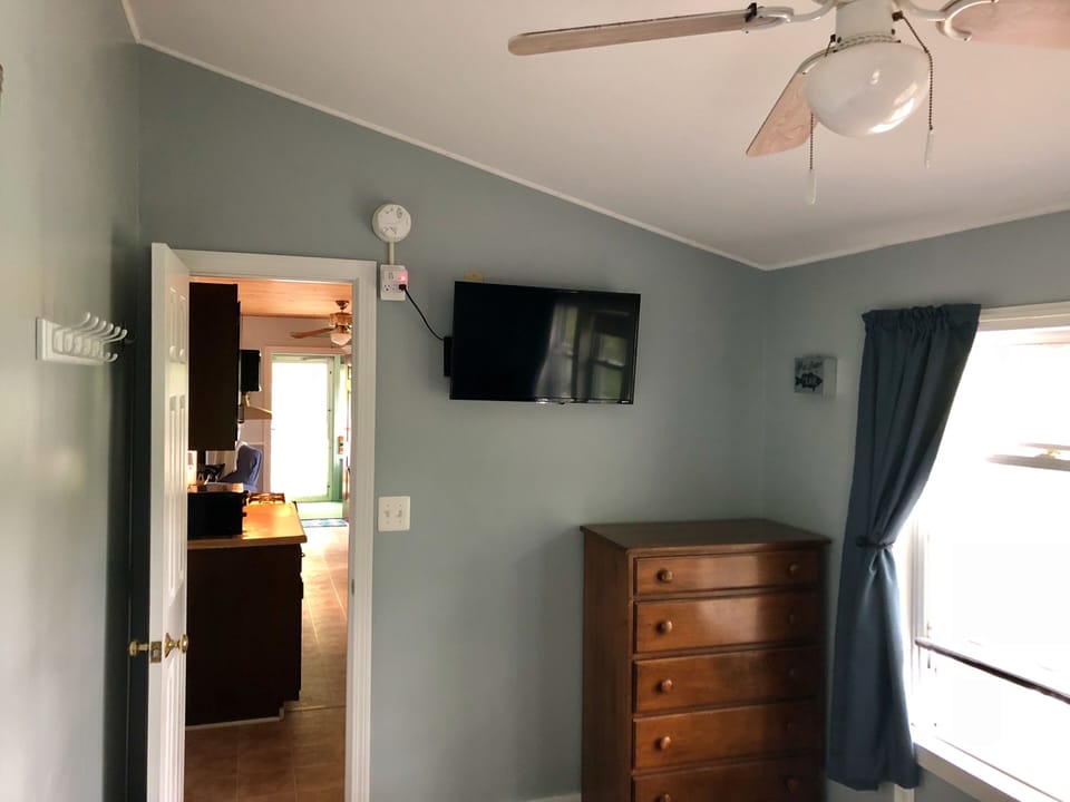 Queen size bedroom with smart tv