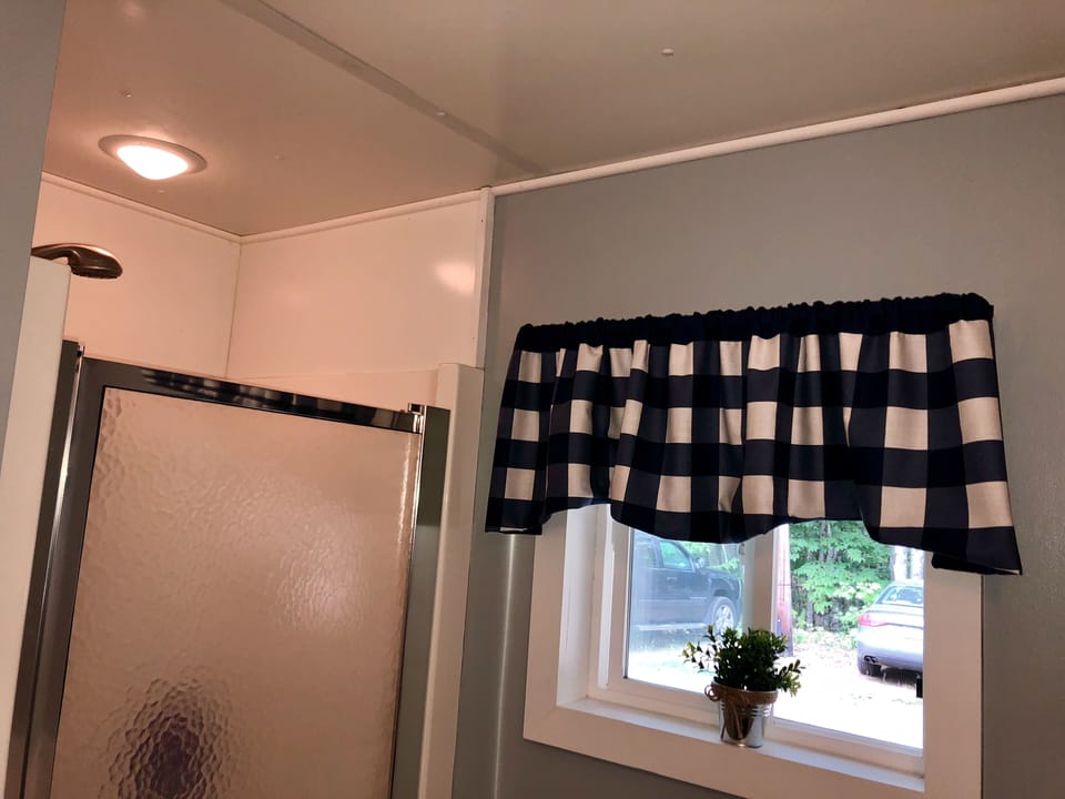 Bathroom, stand up shower.