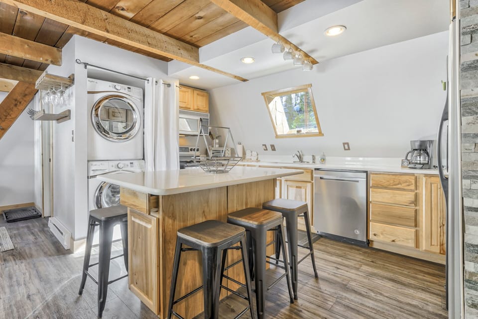 Kitchen with an in unit washer and dryer