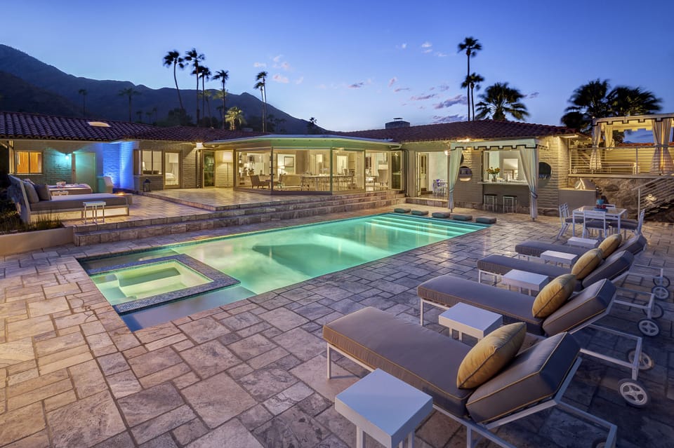 Dusk pool side rear terrace.