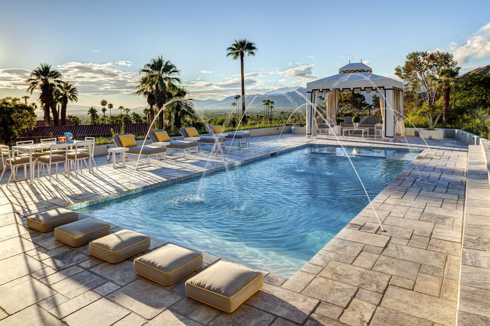 Dramatic water feature, water shelves accent the area by the spa and cabana.