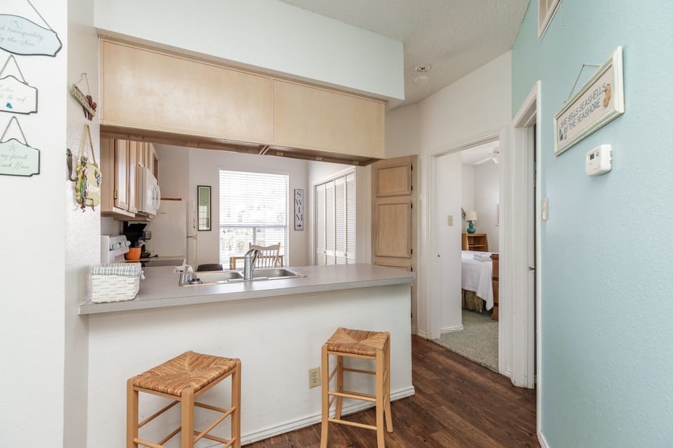 Your fully-equipped kitchen makes morning coffee and evening meals a breeze, with bar seating perfect for casual dining.