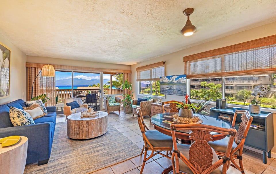 Dining and living room with sleeper sofa - Bright living area at Kahana Sunset E11 with sleeper sofa and ocean breezes