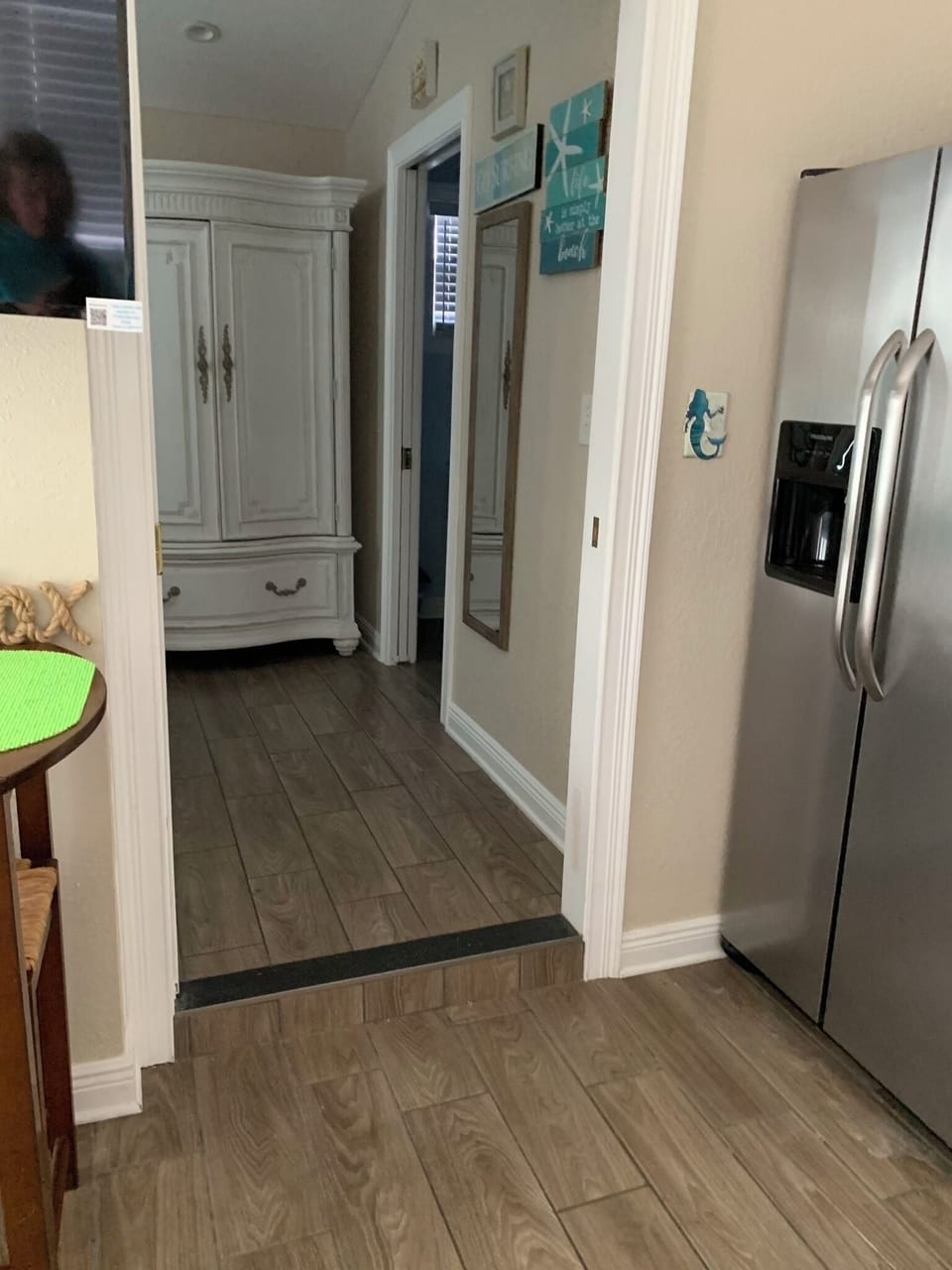 Kitchen steps up into queen room with full bathroom