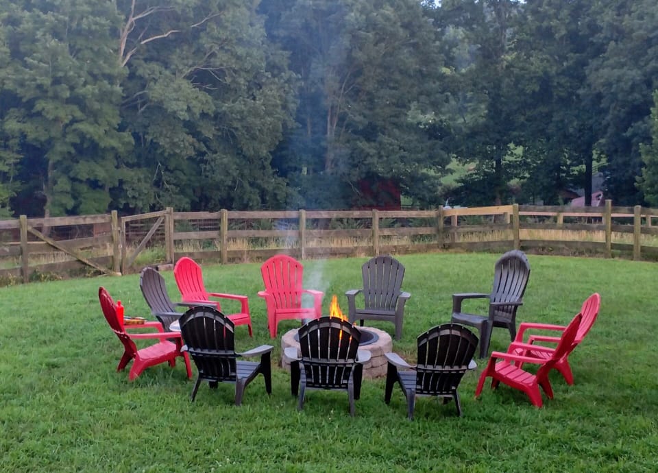 Wood fire pit with comfortable Adirondack chairs. Firewood provided! 