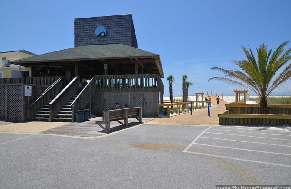Beach pavilion with bathrooms and Rick's Sand Trap Beach Bar & Grill