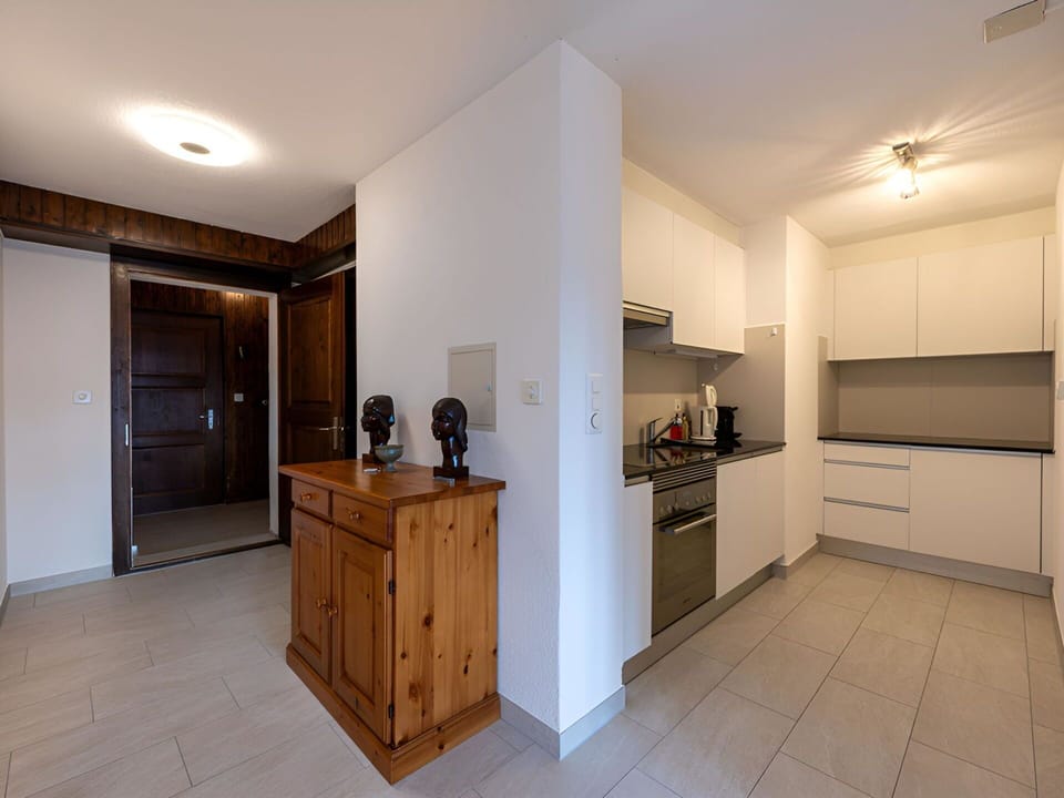 Interior Design, Flooring, Floor, Wood, Ceiling, Countertop, Cabinetry, Room, Furniture, Kitchen