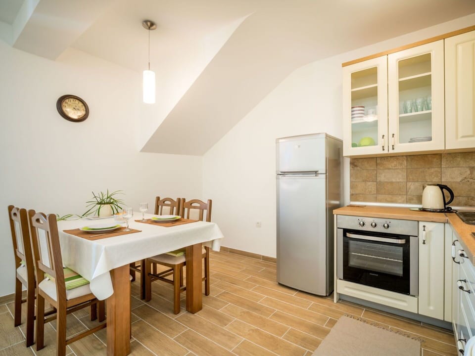 Furniture, Cabinetry, Table, Building, Kitchen Appliance, Kitchen Stove, Wood, Window, Countertop, Interior Design