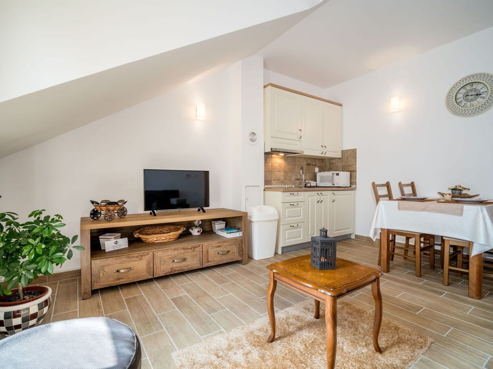 Furniture, Property, Table, Cabinetry, Houseplant, Television, Home Appliance, Wood, Interior Design, House