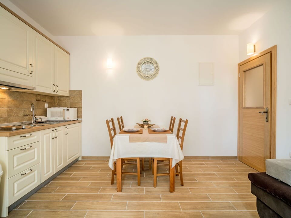 Furniture, Cabinetry, Table, Building, Countertop, Wood, Chair, Drawer, Flooring, Door