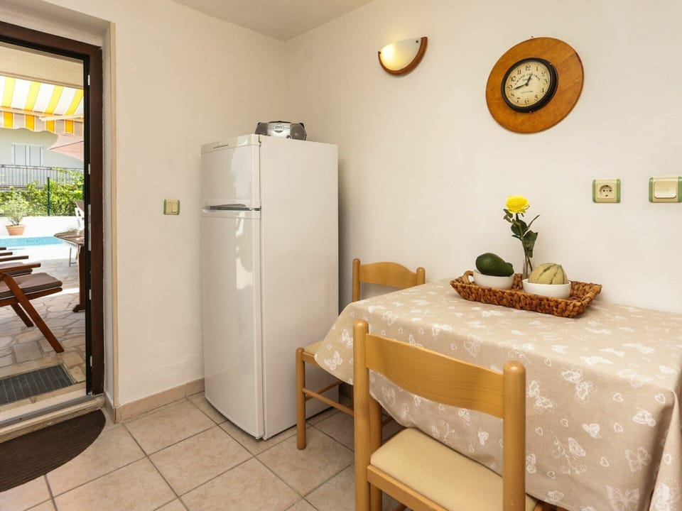 Furniture, Property, Table, Plant, Building, Flower, Interior Design, Lighting, Yellow, Door