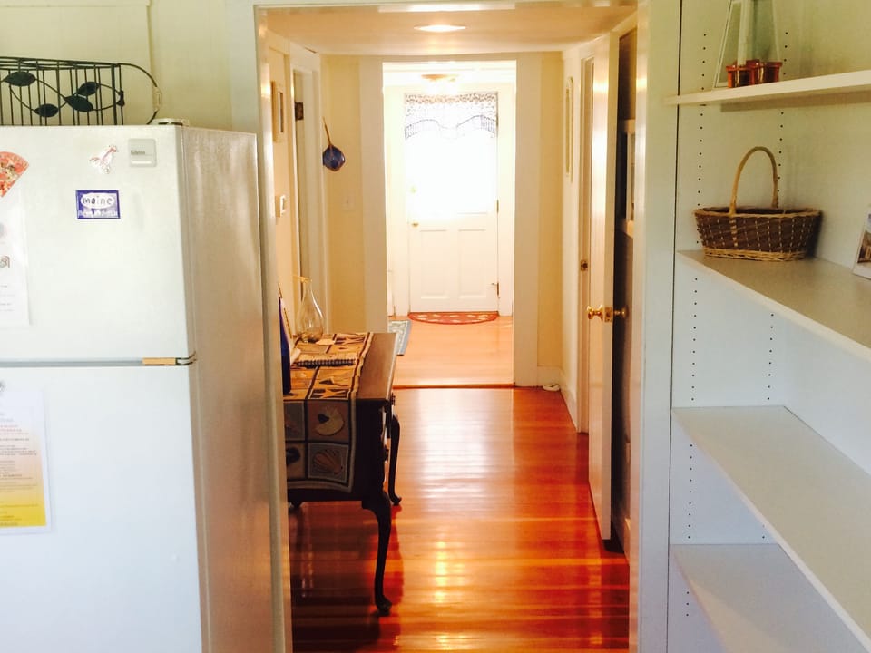 Hallway on first floor. Bedrooms to right and left. Front door in background