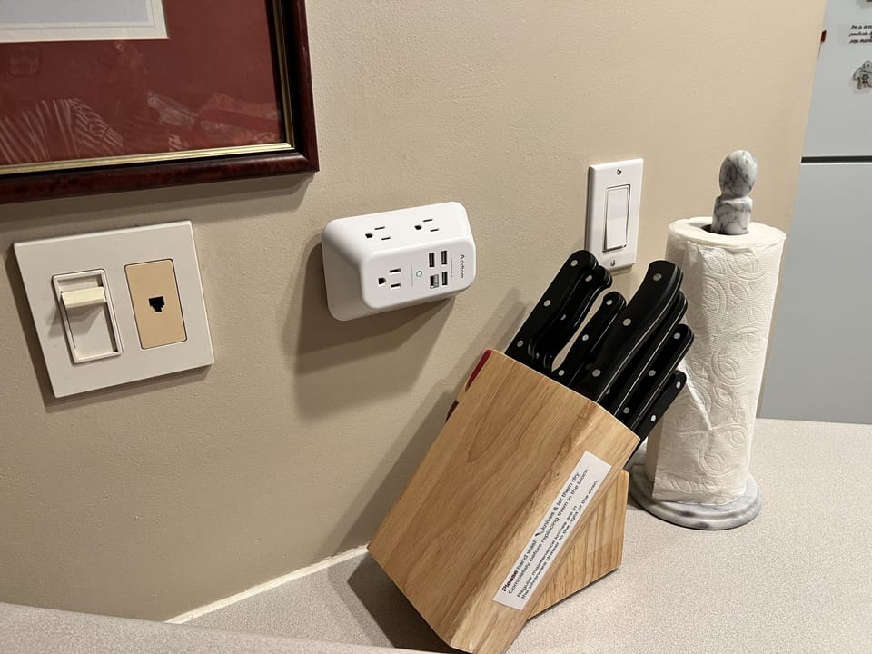 Charger outlets in kitchen, living room, bedroom & by your office desk