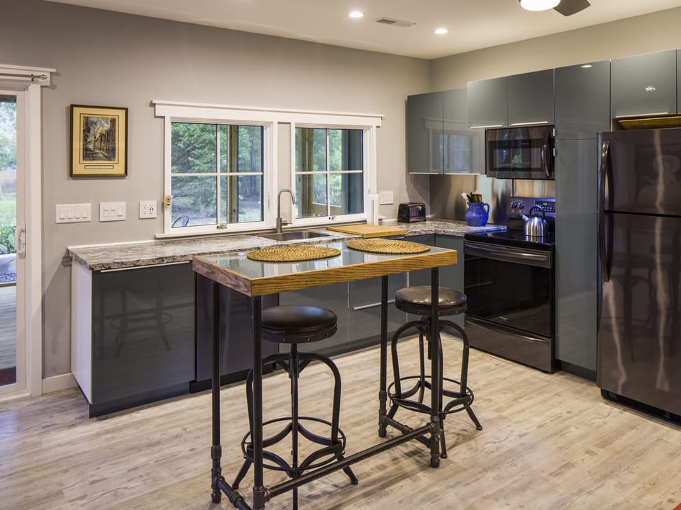 Another view of the kitchen with island. Seating for two. 