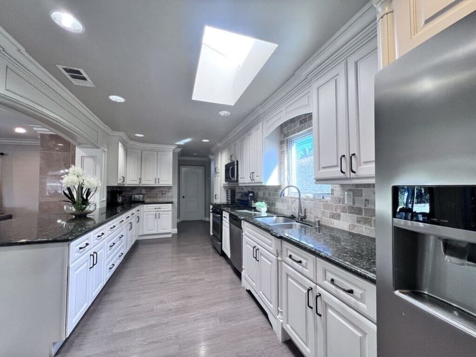 Spacious Custom Kitchen with Granite Countertops
and stainless steel appliances