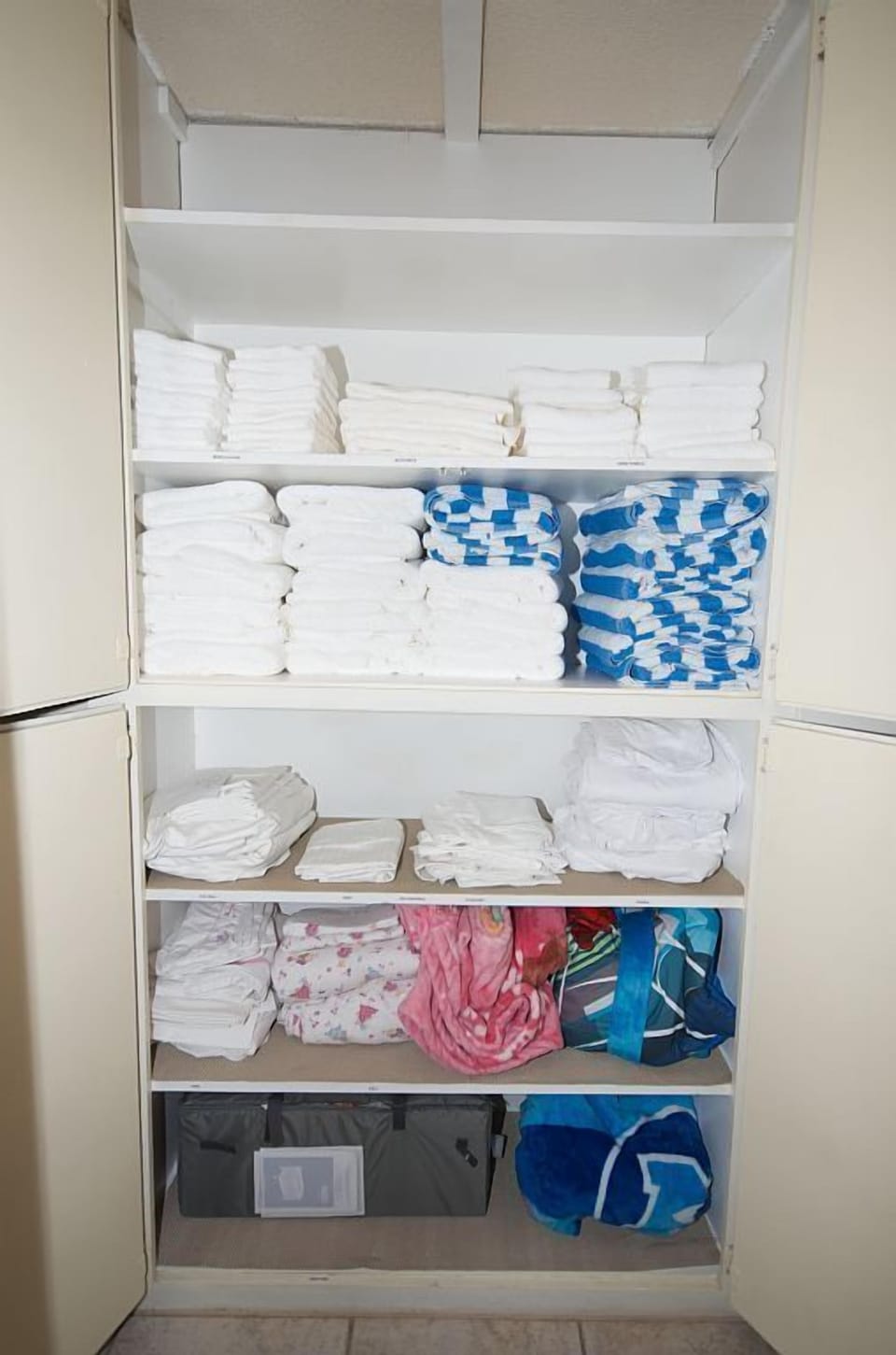 - Linen closet fully stocked with fresh clean towels   - Easy access to essentials for guest convenience   - Organized space ensures comfort throughout stay
