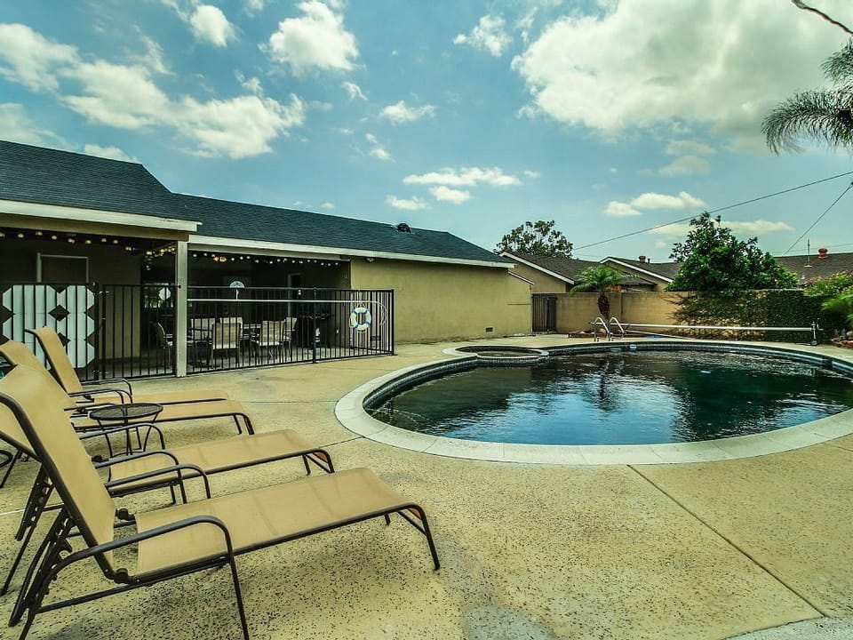 - Poolside retreat with loungers and wide open patio   - Relax outdoors surrounded by comfort and privacy   - Perfect setting for swimming and sun-filled days