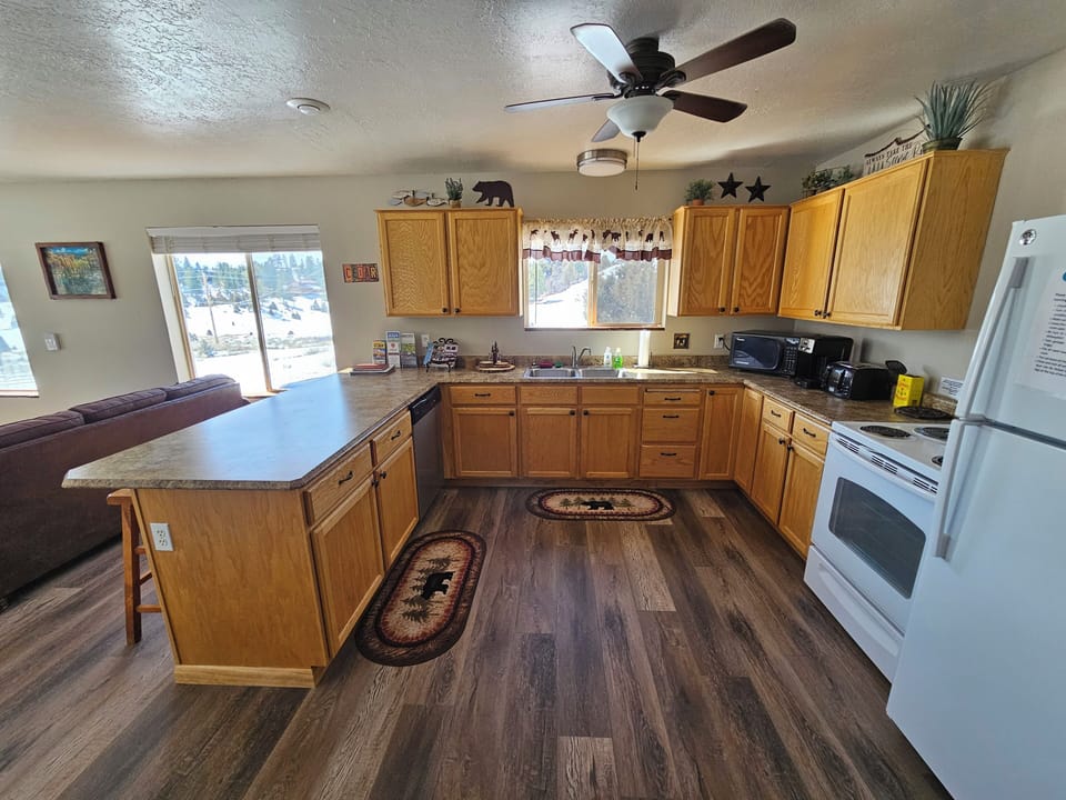 Fully equipped kitchen -- pots, pans, plates, bowls, utensils, crock pot, etc.