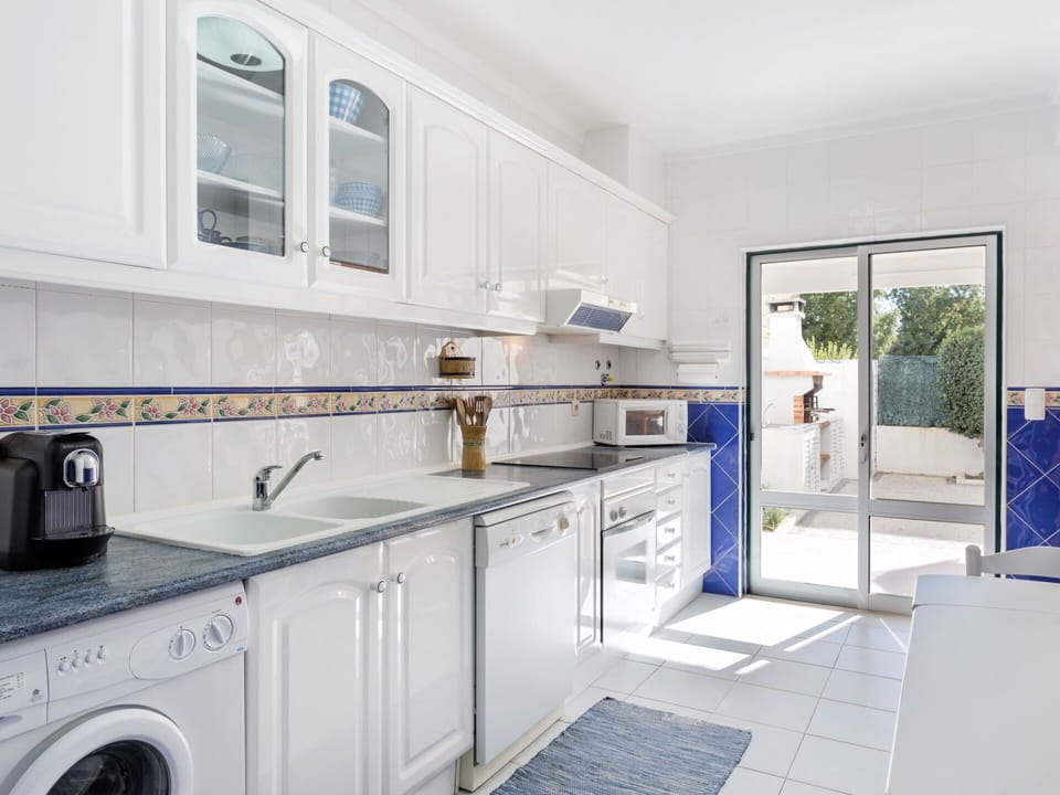Property, Room, Laundry Room, Kitchen, Countertop, Cabinetry, Major Appliance, Tile, Building, Furniture