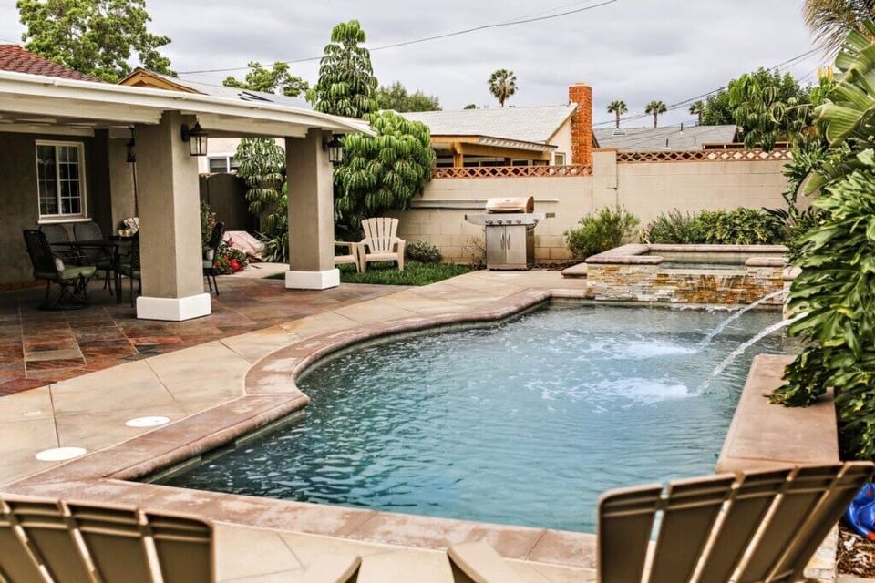 Beautiful Pool and In-ground Jacuzzi with Waterfall Feature view 2